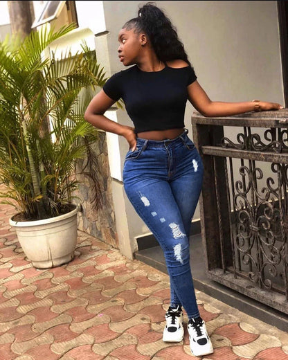 Stylish and versatile denim jeans with a fashionable distressed design, perfect for Kiwi students