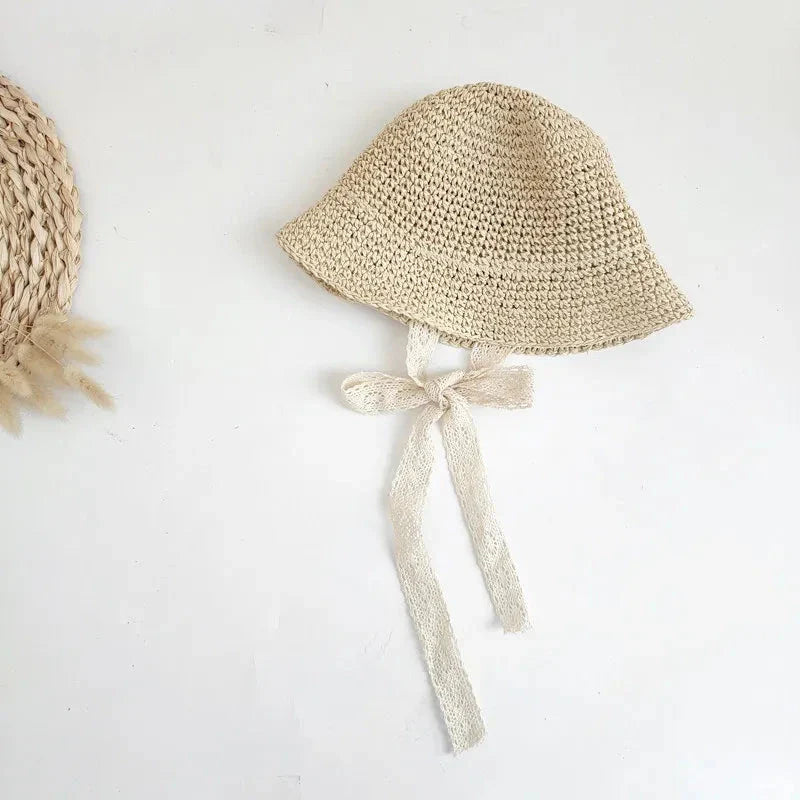 Stylish lace baby sun hat with wide brim for sun protection and adjustable strap for a secure fit on Kiwi babies