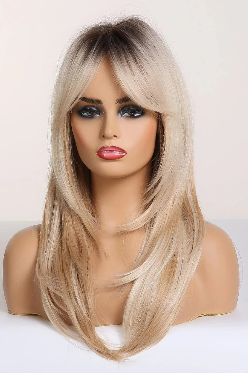 Stylish mid-length wave synthetic wig in cream color with comfortable cap construction and heat-safe synthetic fibres