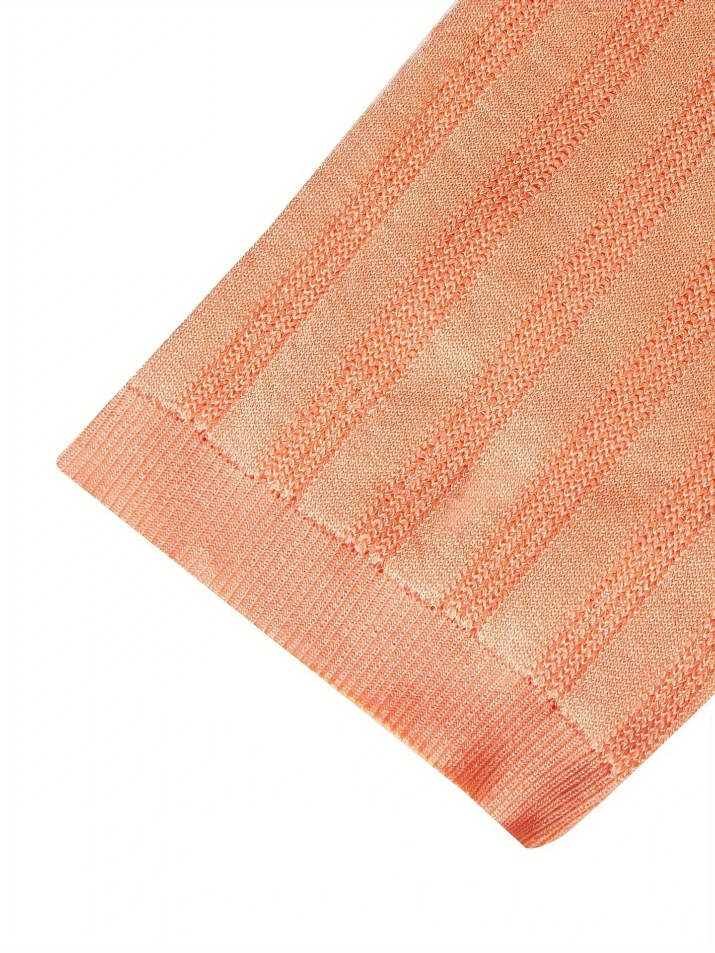 Premium Kiwi-made acrylic knitted tee in a vibrant orange-red hue, featuring a slim-fit design and classic short sleeves