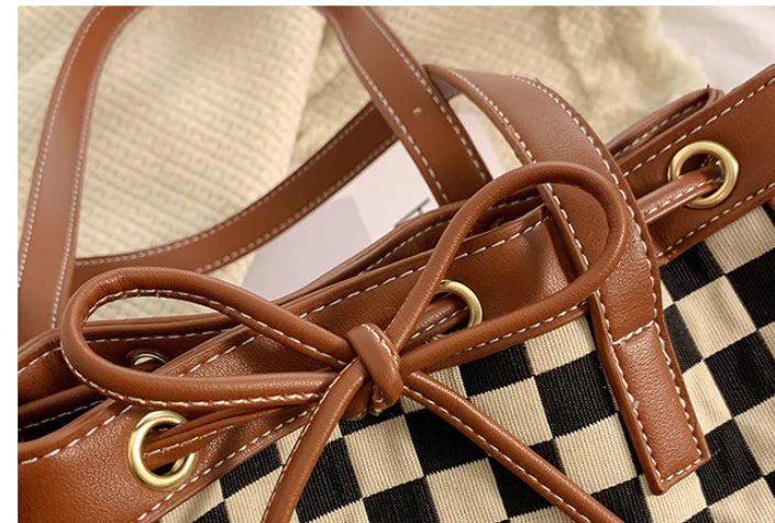 Black PU leather tote bag with a classic checkerboard pattern, perfect for everyday use in the Kiwi lifestyle