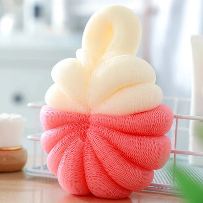 Stylish pumpkin-shaped bath sponges in pink, designed to provide a luxurious and rejuvenating bathing experience