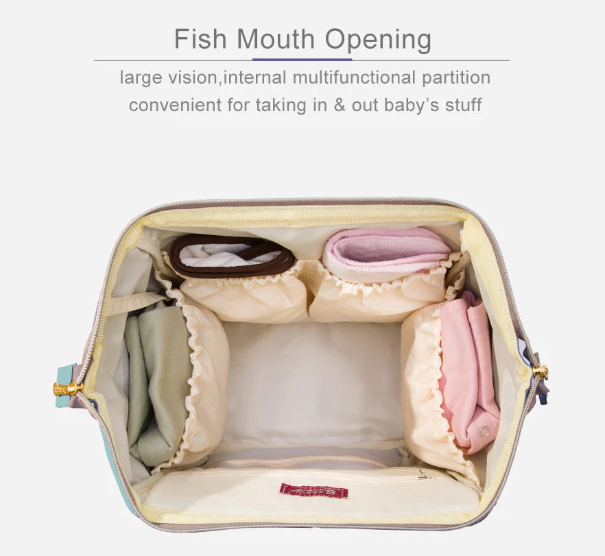 Stylish and practical mummy bag with reinforced handles, durable buckles, and separate bottling area for Kiwi mums