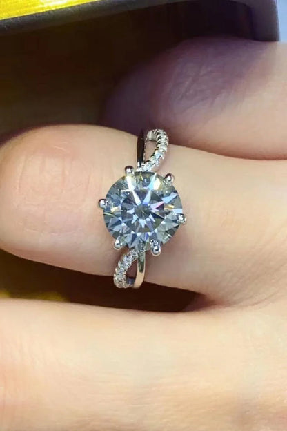 Closeup of a 2-Carat Moissanite Ring in a smokey gray colour, set in 925 sterling silver with sparkling zircon accent stones