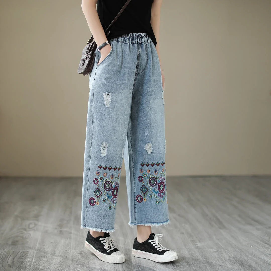 Embroidered denim jeans with distressed details, perfect for the modern Kiwi lifestyle