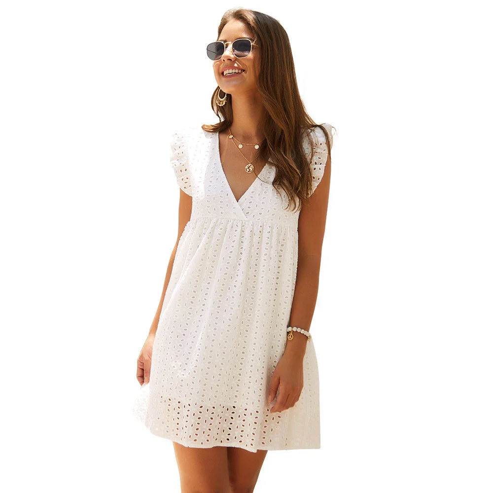 A beautiful white lace dress, designed and made in New Zealand, perfect for casual everyday wear.