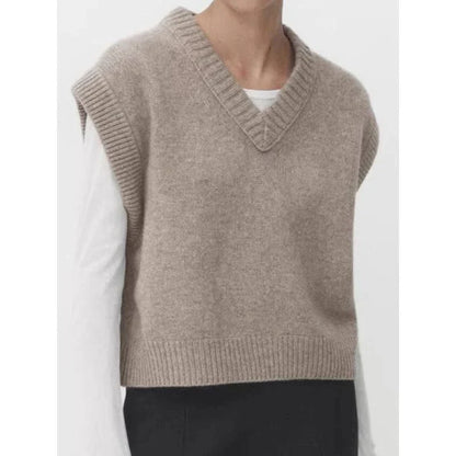 A cosy and stylish women's knitted vest in a neutral colour, with a V-neck design and sleeveless silhouette for easy layering.