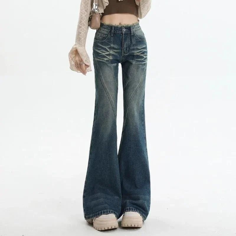 Pair of high-waisted flare jeans in a vintage wash, featuring functional details like tassels and buttons for a stylish, Kiwi-inspired look.