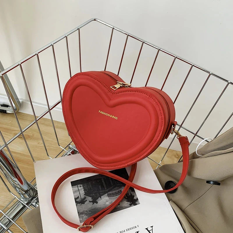 Stylish heart-shaped crossbody bag made from premium PU leather, available in multiple colours for the modern Kiwi woman