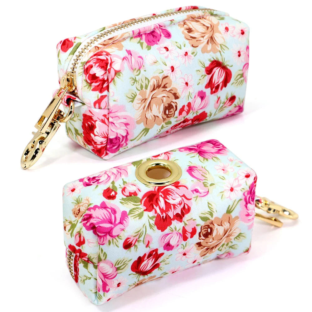 Durable nylon dog bag with floral print design, featuring multiple compartments for treats, waste bags, and other essentials.