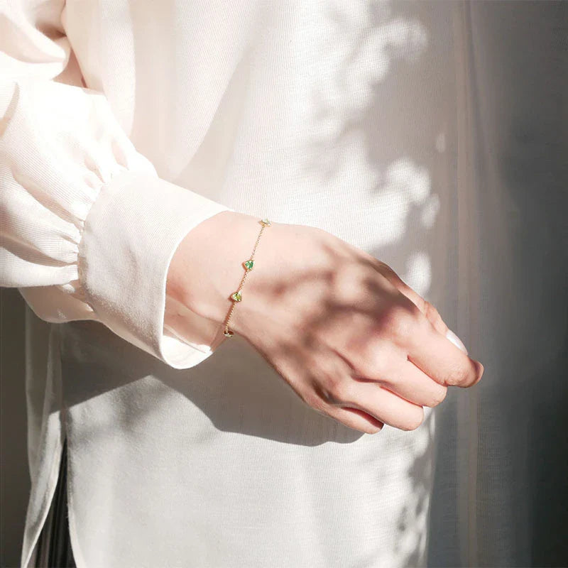 A beautiful, eco-friendly bracelet featuring natural green gems in a modern geometric design