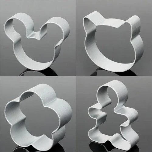 A set of trendy, eco-friendly metal cookie cutters in various geometric shapes, perfect for sustainable baking in New Zealand