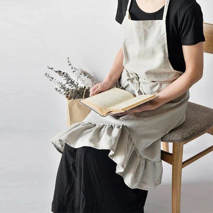 A nordic-inspired linen pleated apron with an adjustable design, perfect for baristas and home chefs in New Zealand.