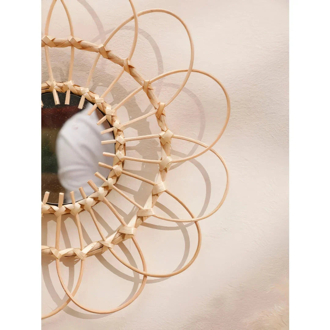 Handmade rattan wall mirror with a flower-shaped design, adding natural elegance to a Kiwi home decor
