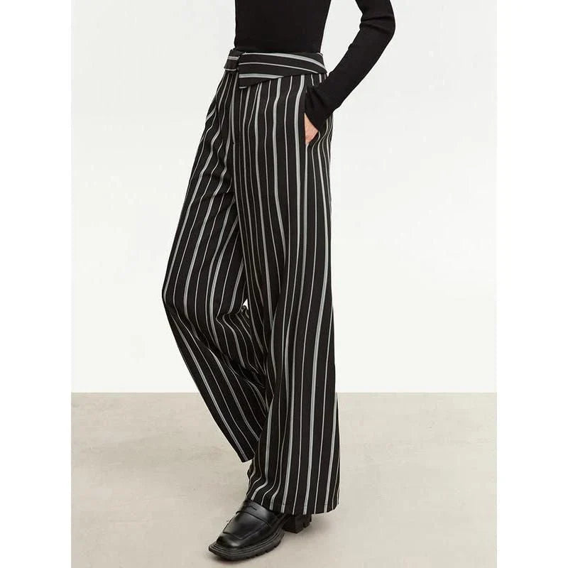 Elegant autumn wide-leg striped trousers for women in a classic black and white pattern