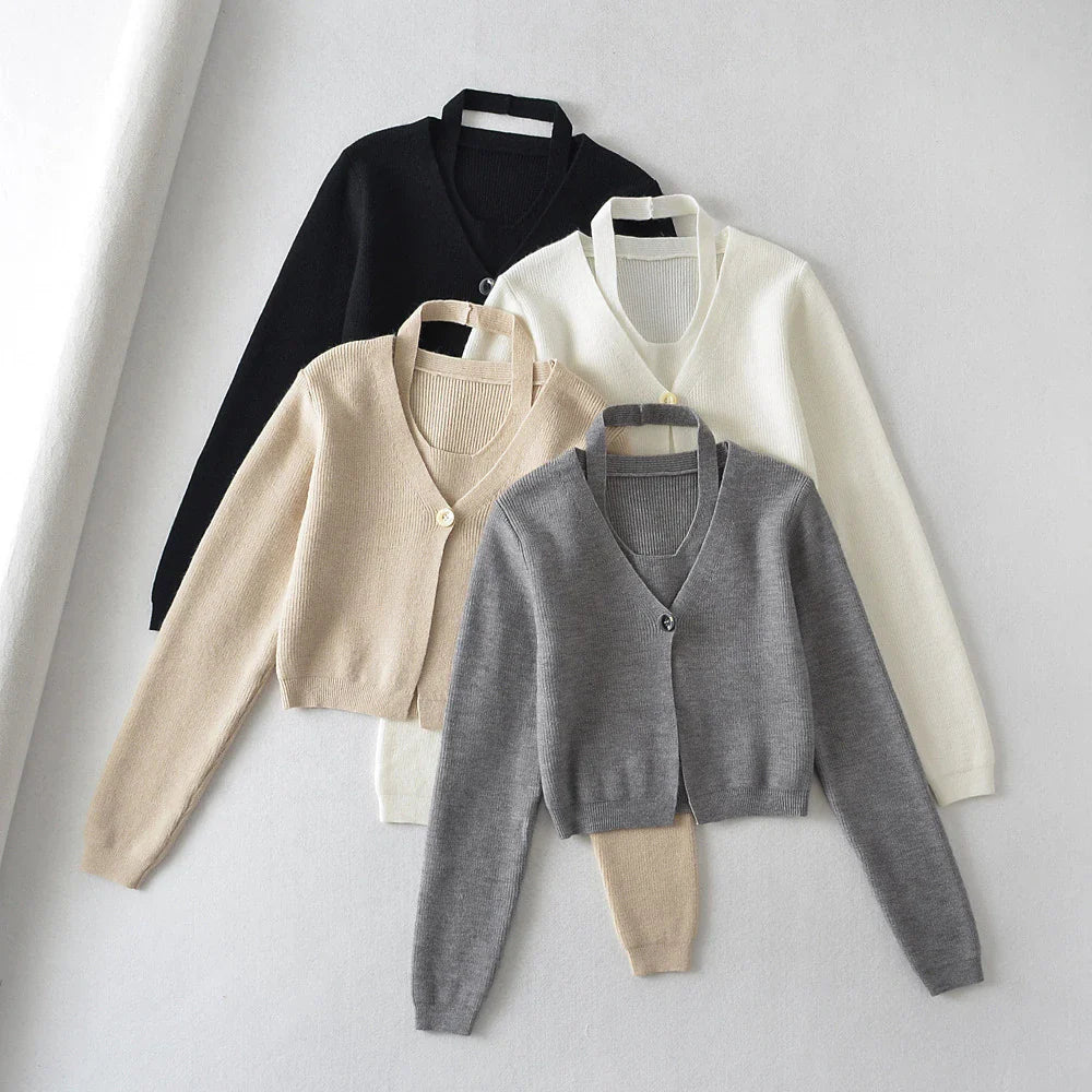 Stylish knitwear vest in a classic black or neutral colour, featuring a V-neck collar and long sleeves for a polished, versatile look.