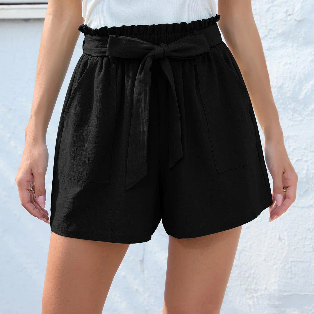 Stylish high-waisted ruffle bow shorts in black, perfect for Kiwi summer beach and casual wear