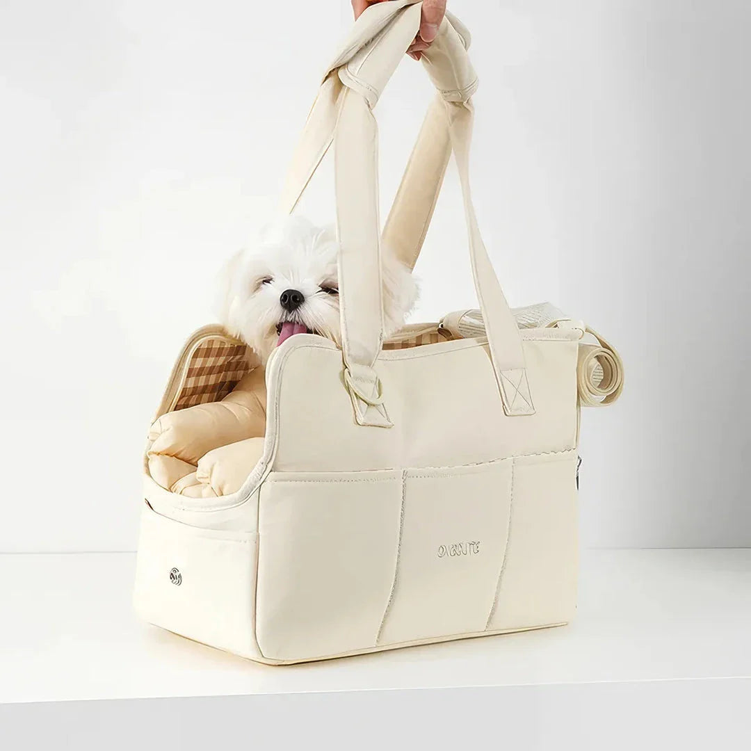 A stylish and practical cotton shoulder bag carrier for small dogs, with a hard board base and cozy interior for comfort and security during adventures.