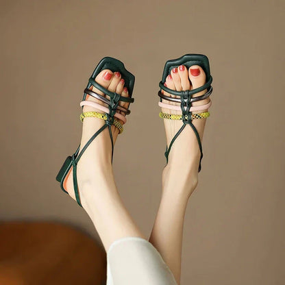 Vibrant Roman-inspired sandals with chunky heel, showcasing a stylish and comfortable summer footwear option