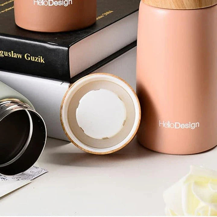 Compact and insulated mini coffee mug in pink color, featuring durable stainless steel construction and leak-proof lid for Kiwis on the go