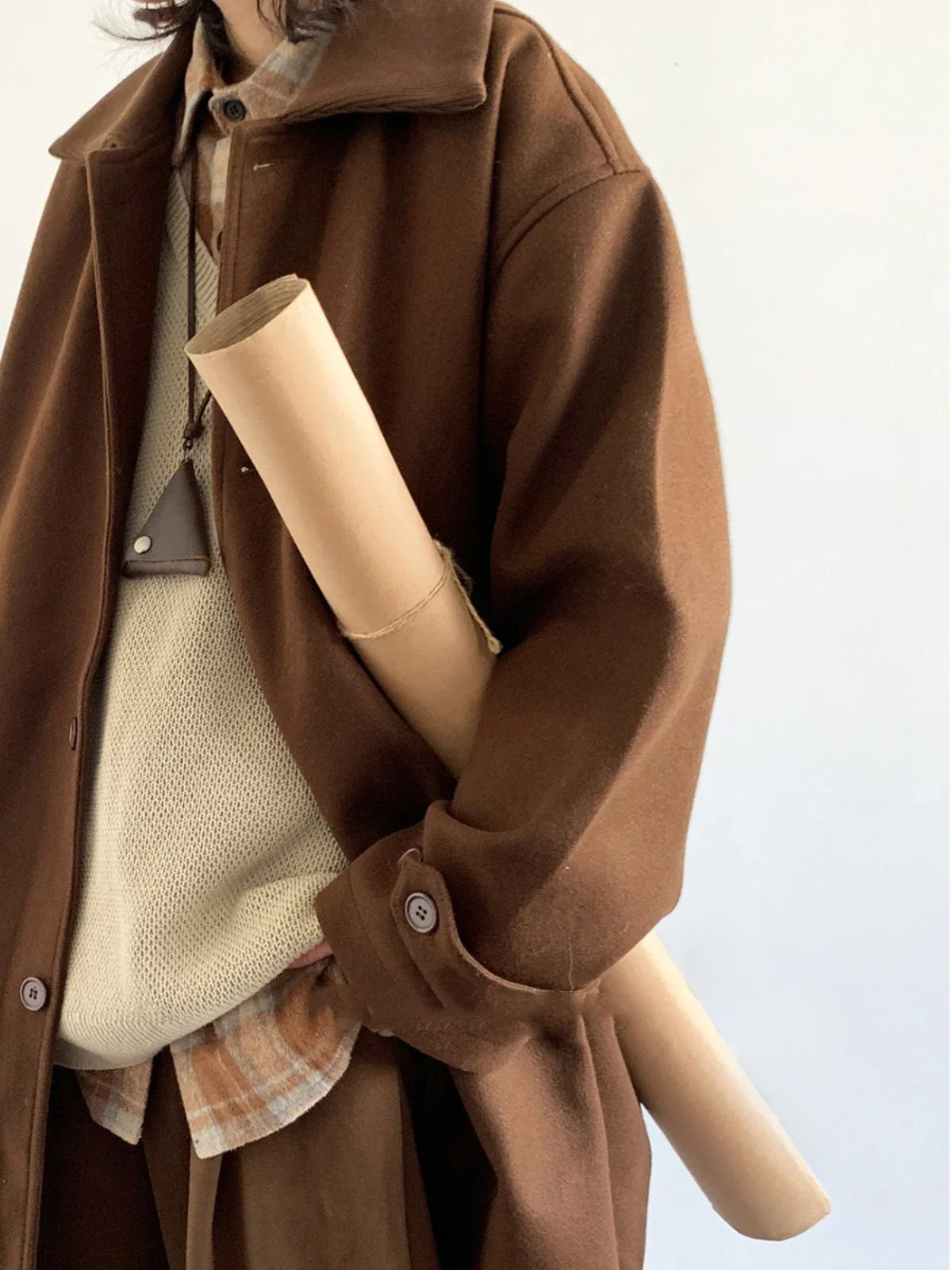 Premium woollen coat in a retro Japanese-inspired style, with a relaxed fit and earthy tones perfect for the Kiwi winter.