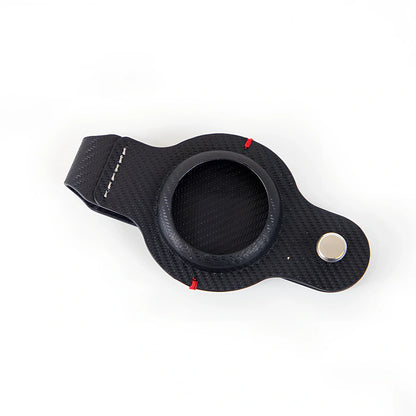 Black PU leather AirTag holder keychain with metal ring, 4cm diameter, secure snap fit for tracking valuables