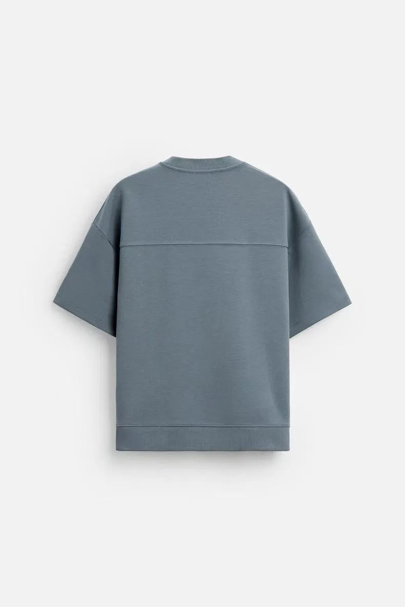 Loose fit short sleeve t-shirt and matching shorts set in blue, shown on a hanger