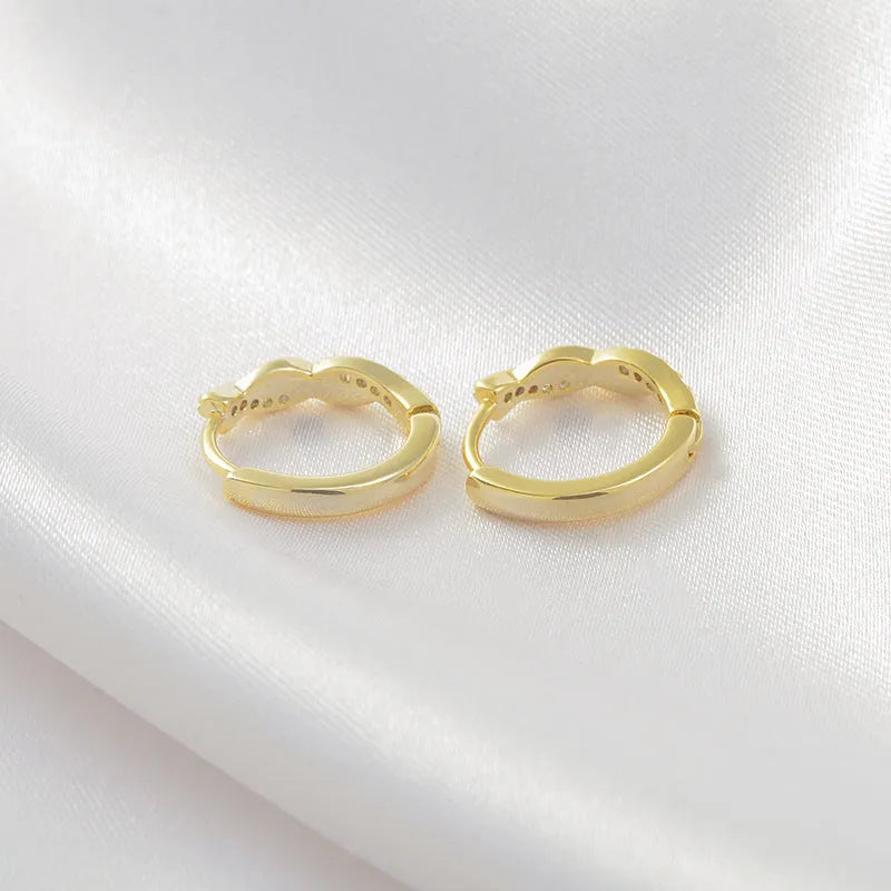 Gold and silver geometry-shaped interwoven hemp rope earclip earrings for women.