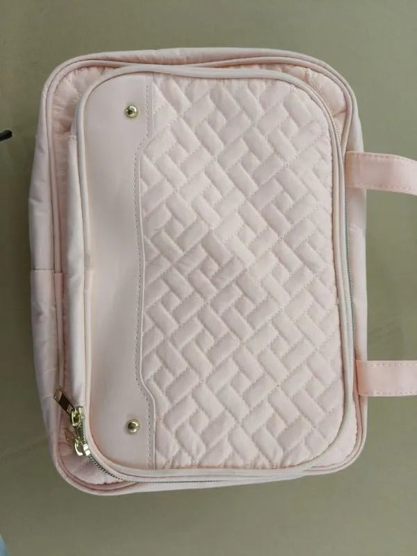 Pink waterproof hanging cosmetic bag with dimensions 30.5cm wide by 22.9cm tall