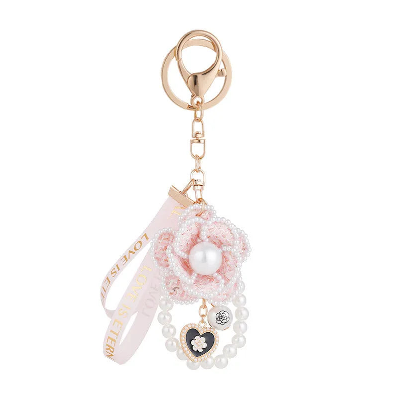 Camellia key chain with ribbon and pearl accent in Korean style, available in four colours