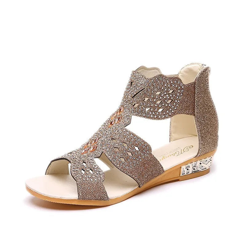 Women's flat open-toe sandals with rhinestone detail and a back zipper in beige.