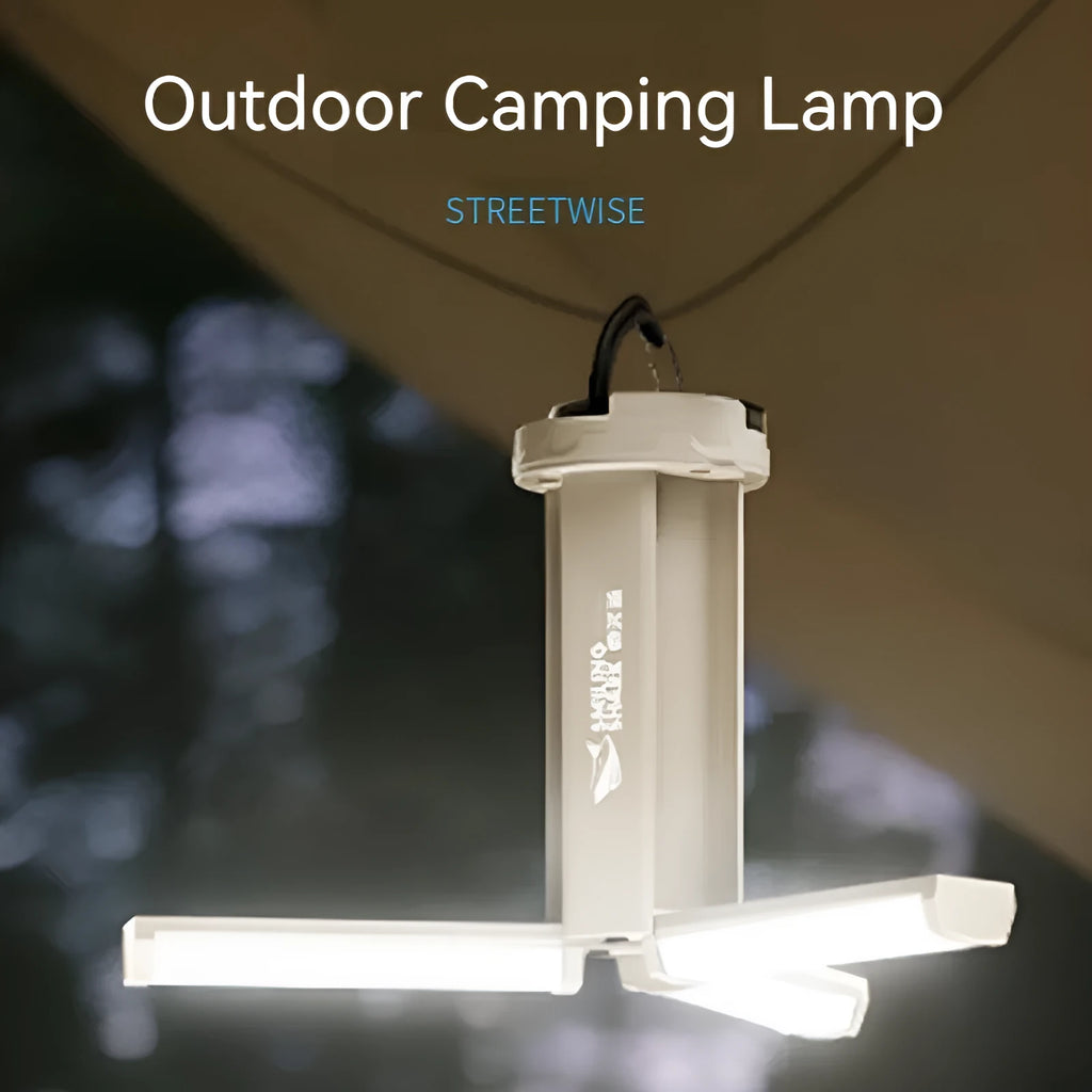 White cylindrical camping lamp with magnetic base and charging port showing LED light array