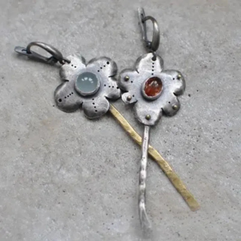 Long geometric flower earrings with retro styling and asymmetric two-colour electroplated finish