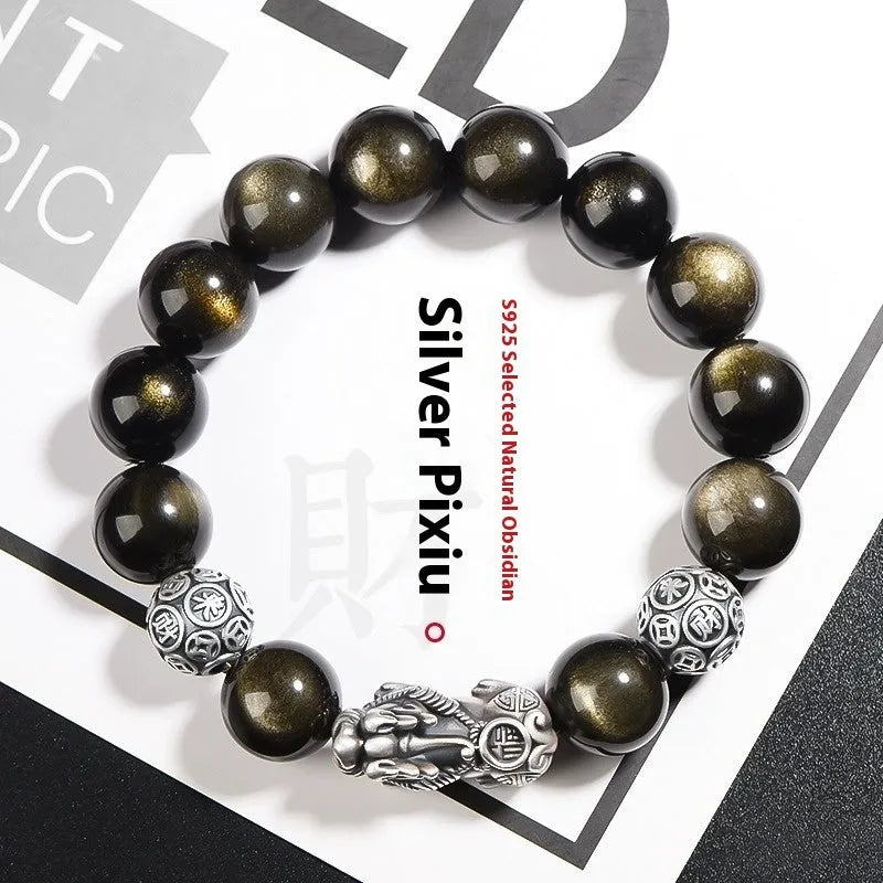 Men's geometric bracelet made of black obsidian and polished 999 sterling silver, showing its width and structured design.