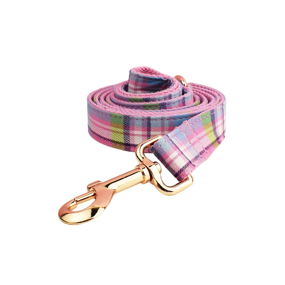 Four-piece dog collar set with matching leash, bow and vest in cloth fabric