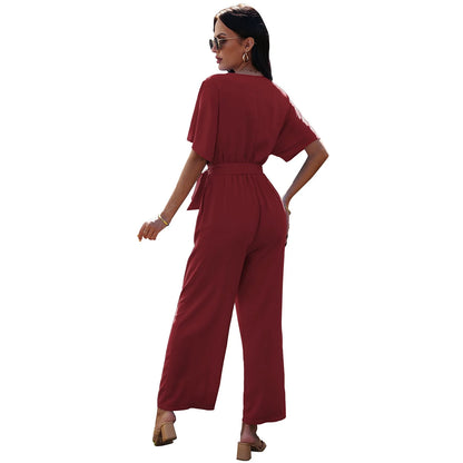 Women's V-neck tie waist jumpsuit in black, dark red, and sky blue