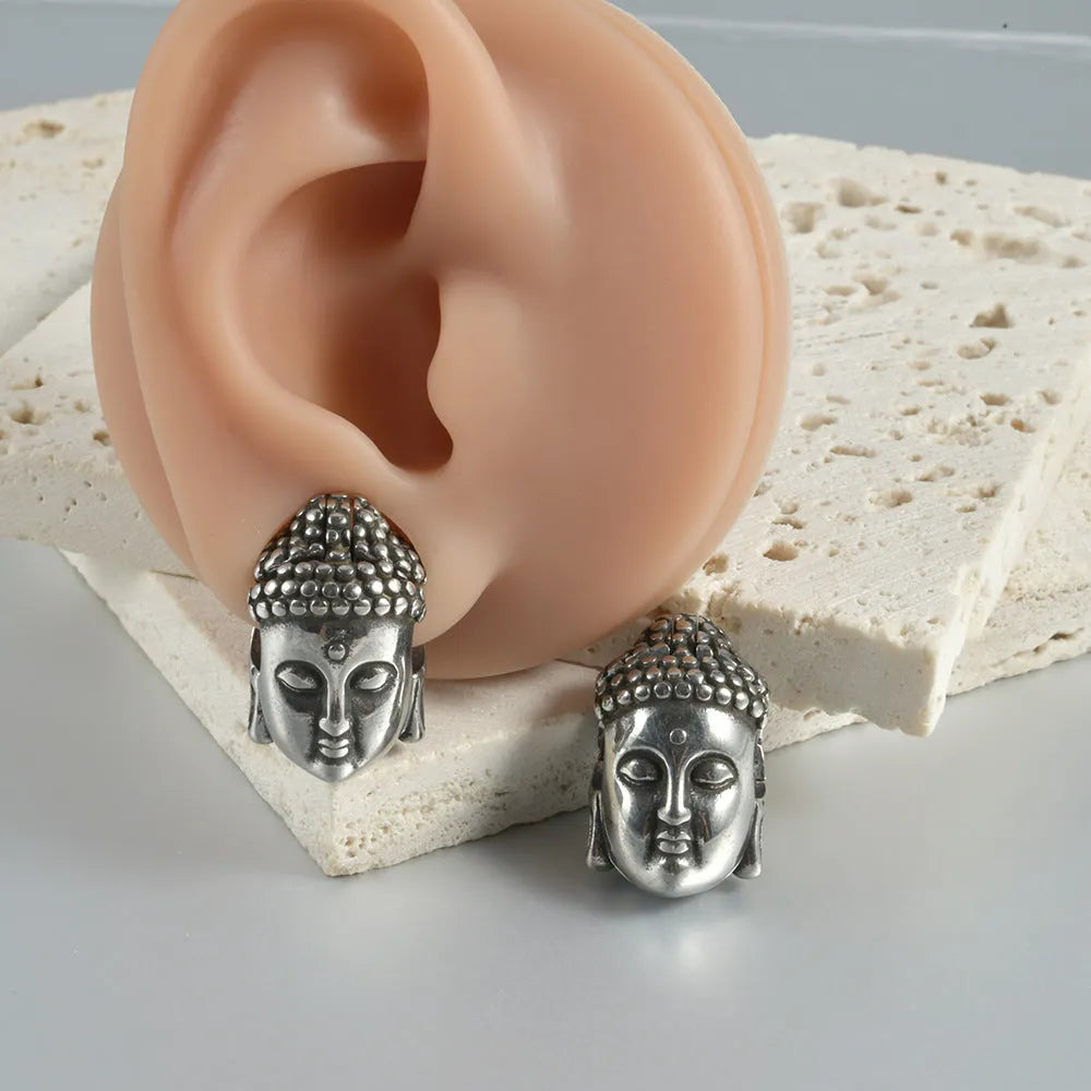 Stainless steel hollow skull and Buddha head geometric ear cuff for hip hop style.