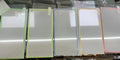 Fluorescent luminous tempered glass screen protector for iPhone in pink, yellow, green, blue, and grass green colours.