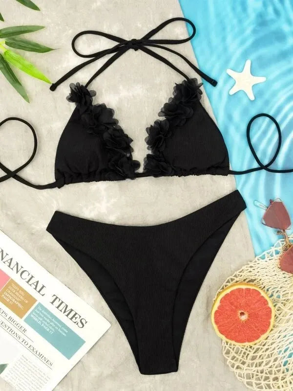 Black women's swimwear set with gathered top and matching shorts on European and American sizing