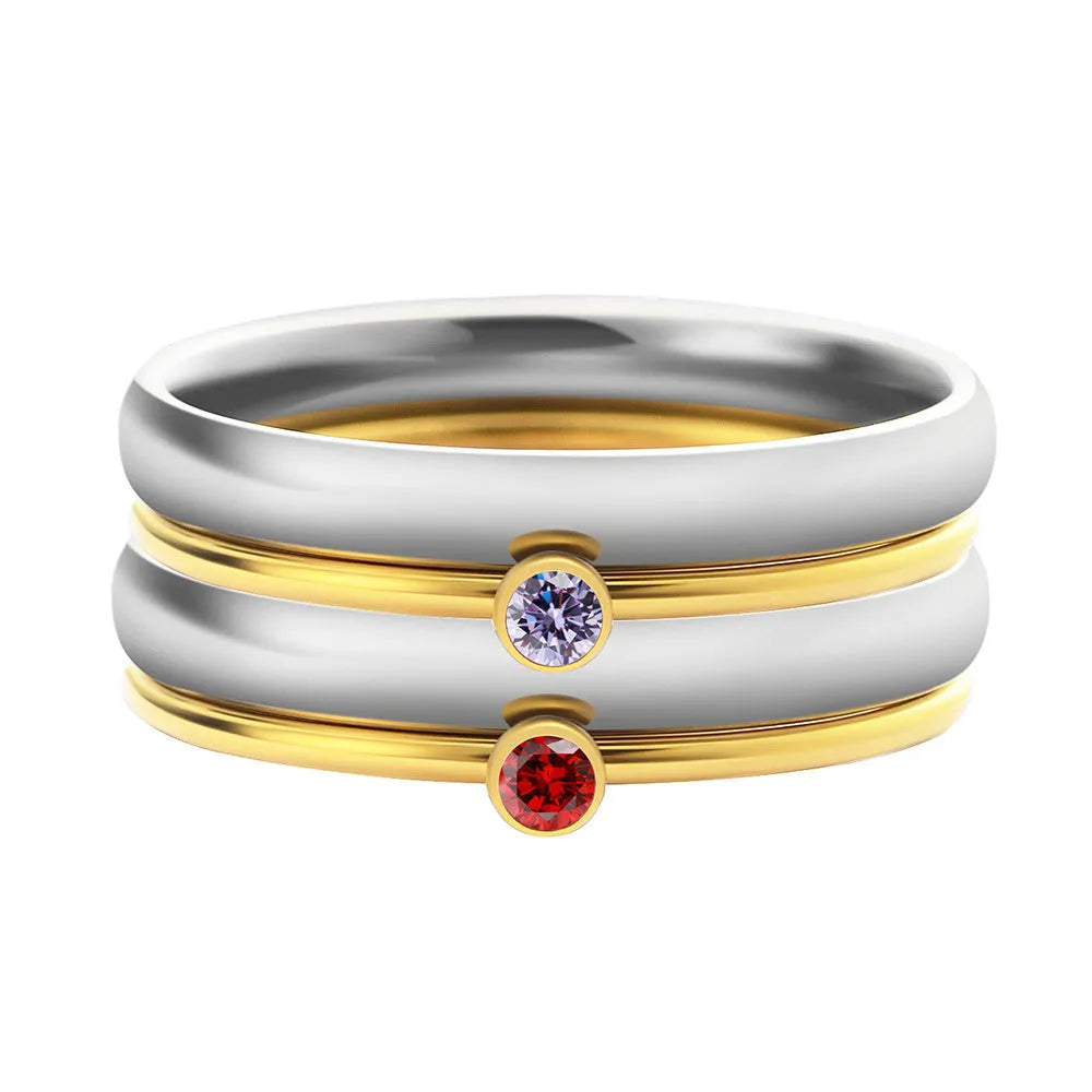 Titanium steel December birthstone ring with gold engraved lettering on a geometric band.