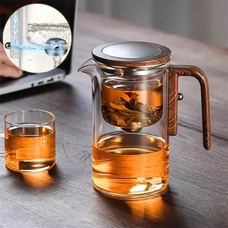 Elegant glass teapot with magnetic separation technology, wooden handle, and drip-free spout for a consistently smooth and flavorful cup of tea