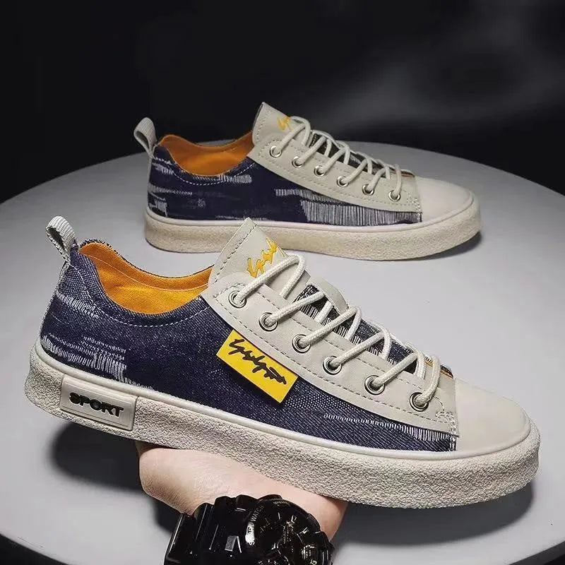 Men's casual canvas lace-up shoes with round toe in black, dark blue, or light blue on a rubber sole.