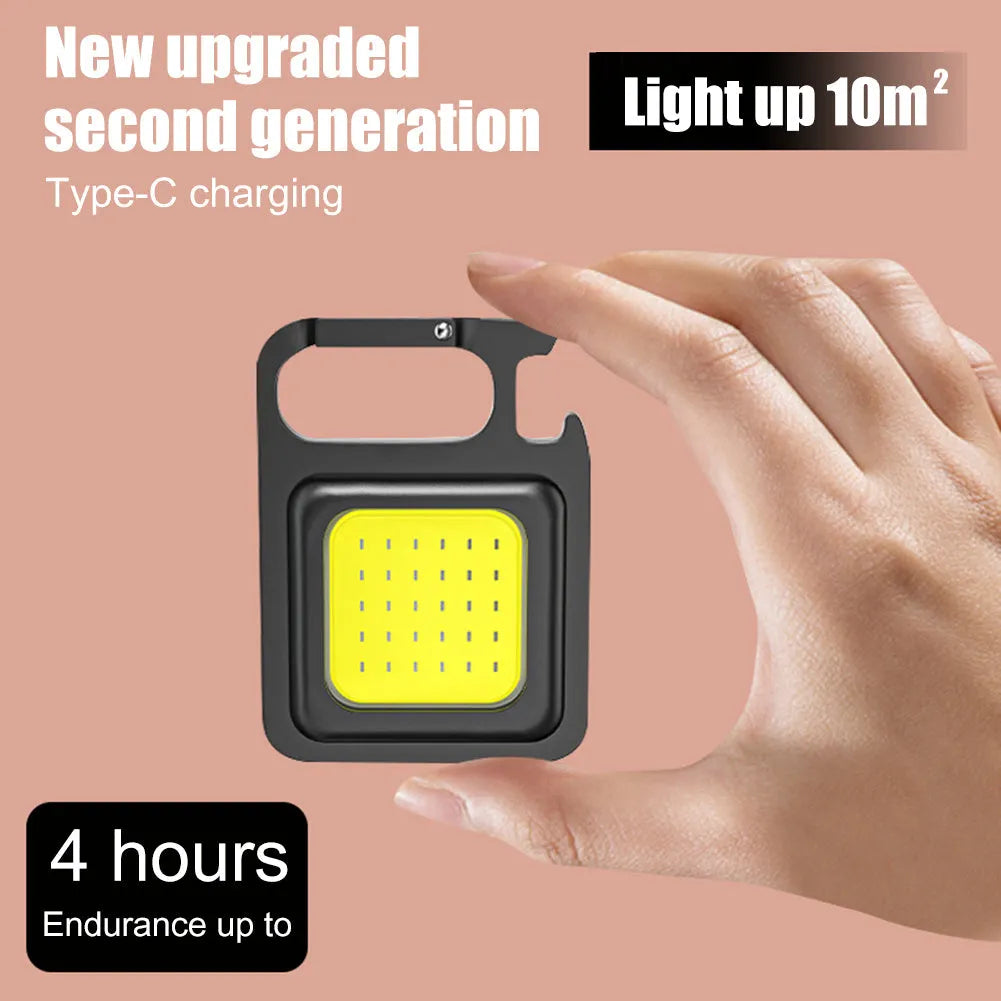 Mini rechargeable COB keychain flashlight with 400 lumens, USB cable, and hook for hands-free use as work light
