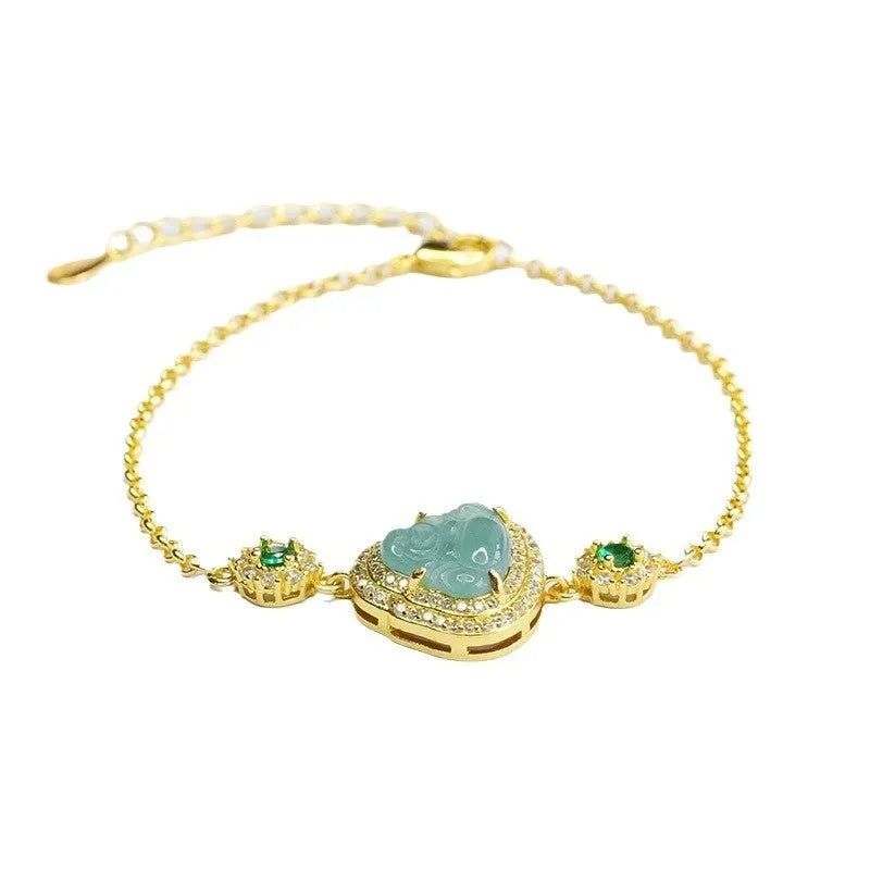 Blue water jade bracelet with oval 10x13mm bead showing inlaid Maitreya Buddha carving