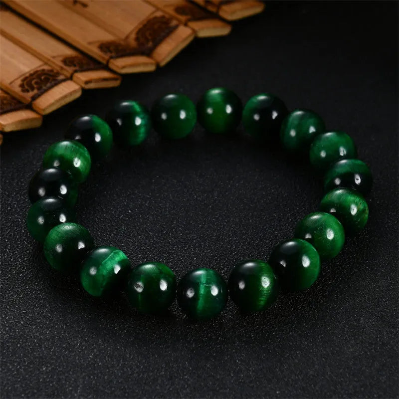 Green tiger eye stone geometric bead bracelet shown in different size options on a wrist.