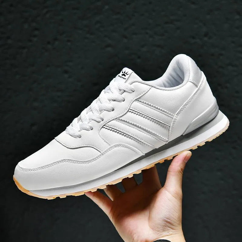 Men's black space leather running shoes with carved wing pattern and mesh lining