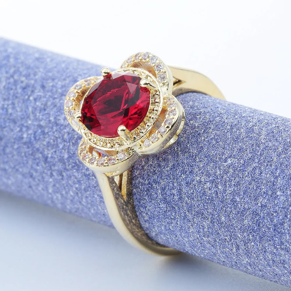Copper ring with a fruit-shaped zircon stone inlay on a finger.