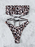Leopard print bandeau split bikini swimsuit with removable chest pads on woman at beach