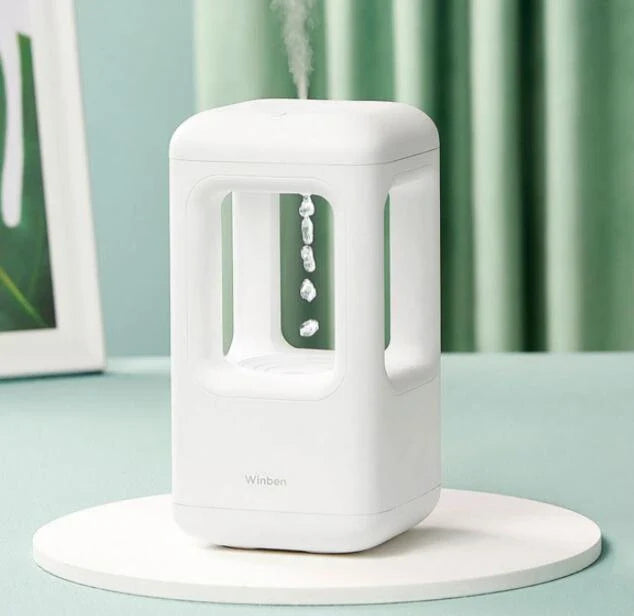 Whisper-quiet humidifier with captivating water drop effect, designed for optimal air quality and soothing ambiance in the bedroom