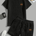 Men's black sports two-piece set with ribbed short sleeves and matching shorts